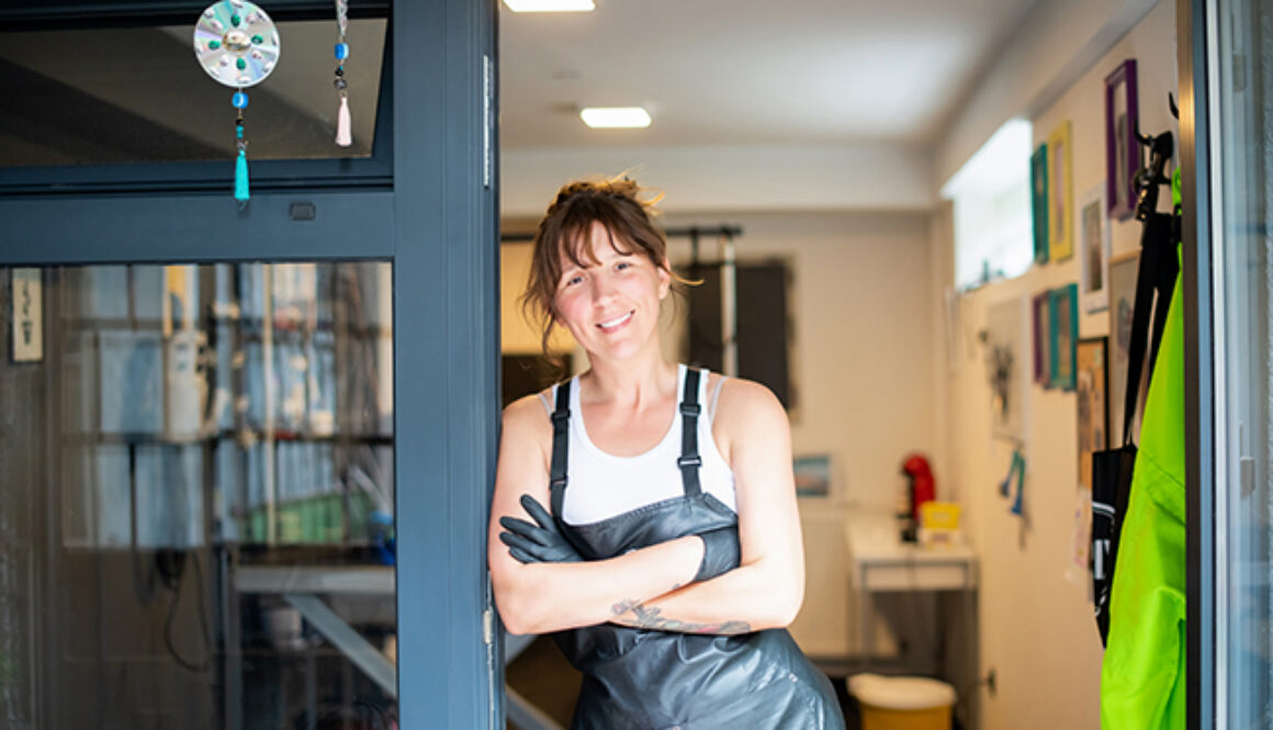 portrait of professional pet hairdresser hipster woman