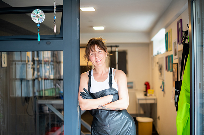 portrait of professional pet hairdresser hipster woman